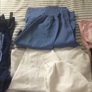 Lot of scrub tops, bottoms and jackets